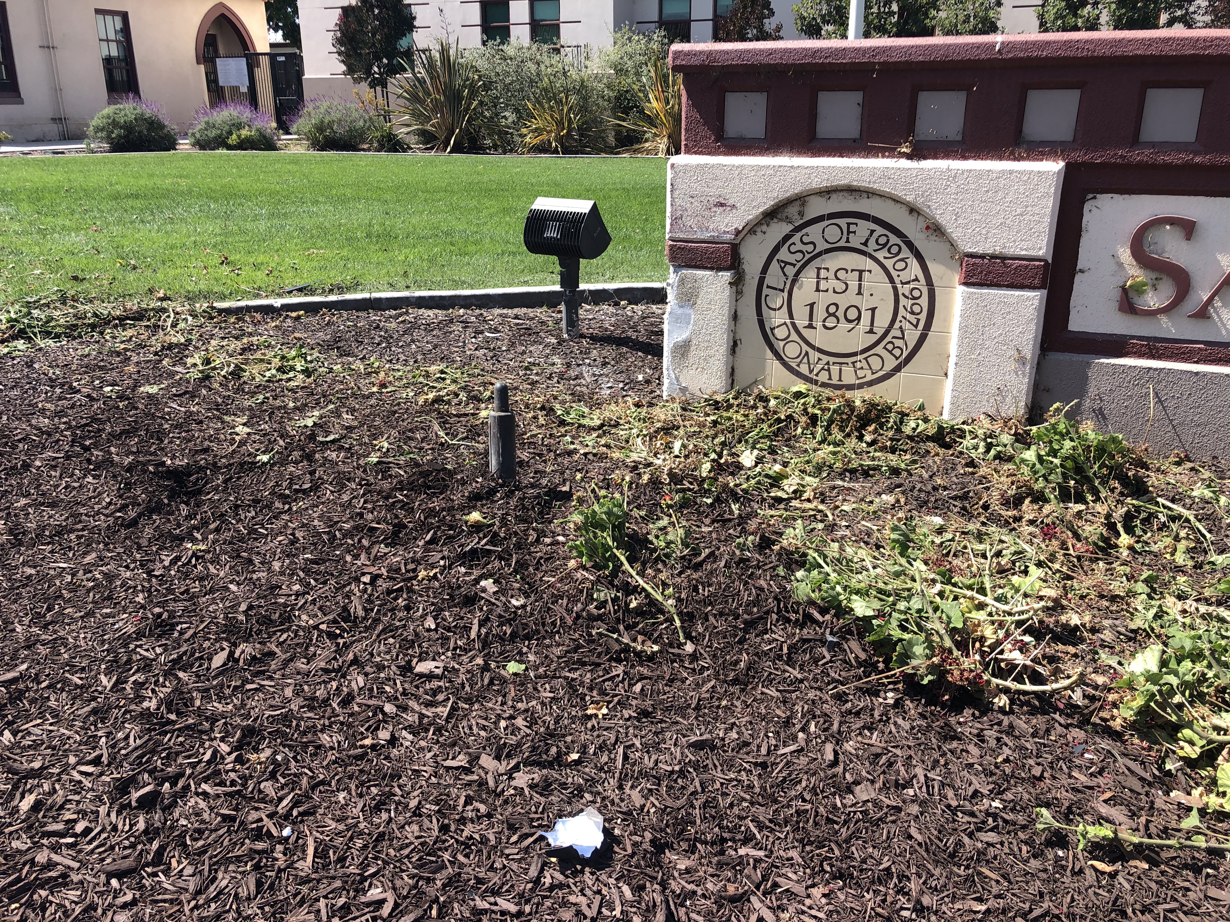 Driver leaves road, clips Santa Maria High School sign