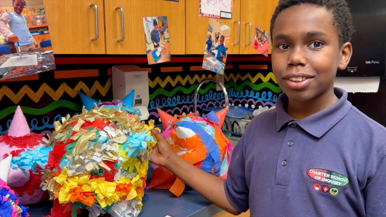 Students at Charter School of Inquiry showing off Africana infusion art - Vimarsana News